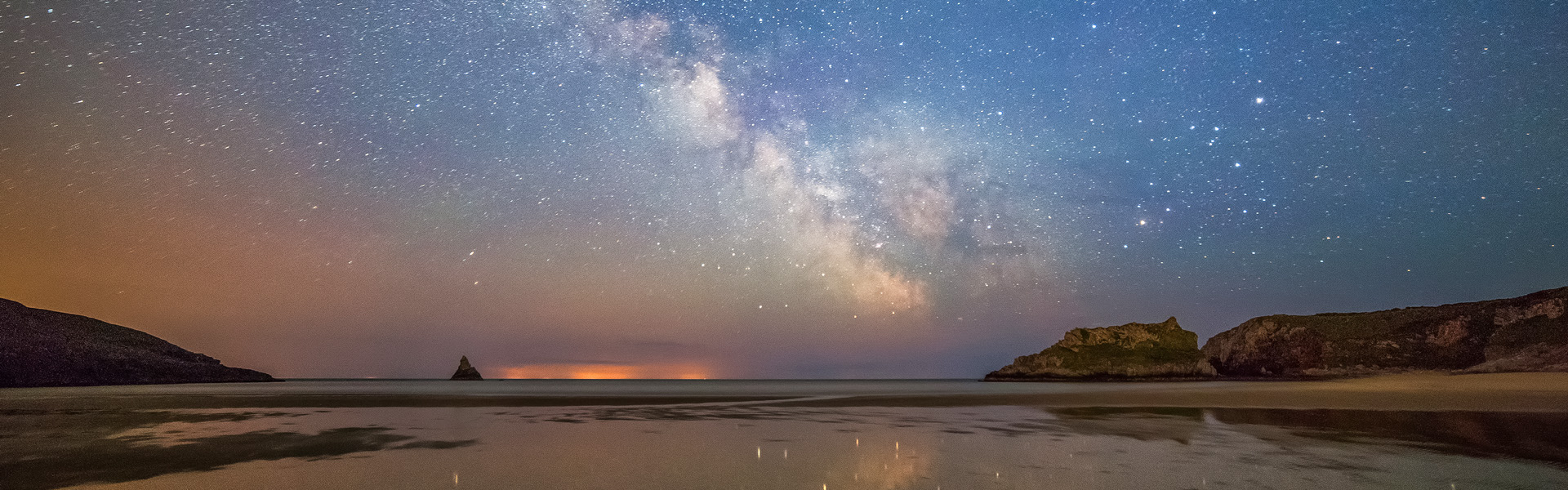 Milky Way streak across the sky at Broad Haven beach in south Pe